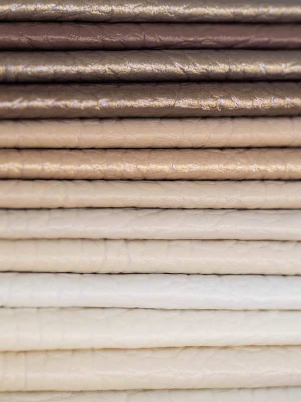 Catalog of multicolored imitation leather from matting fabric texture background, leatherette fabric texture Catalog of multicolored imitation leather from matting fabric texture background, leatherette fabric texture. Industry background.